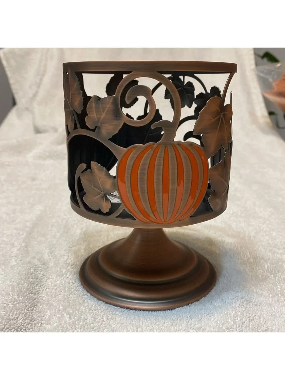 Retired Bath and Body Works Pumpkin candle holder, pedestal style.
